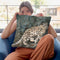 Snow Leopard Climbing Up Throw Pillow By David Stribbling