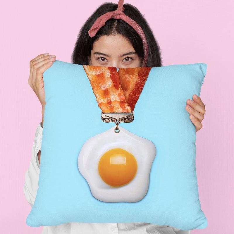 Egg Medal Throw Pillow By Paul Fuentes